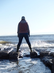 FZ011813 Jenni playing with waves on Llantwit Major beach.jpg